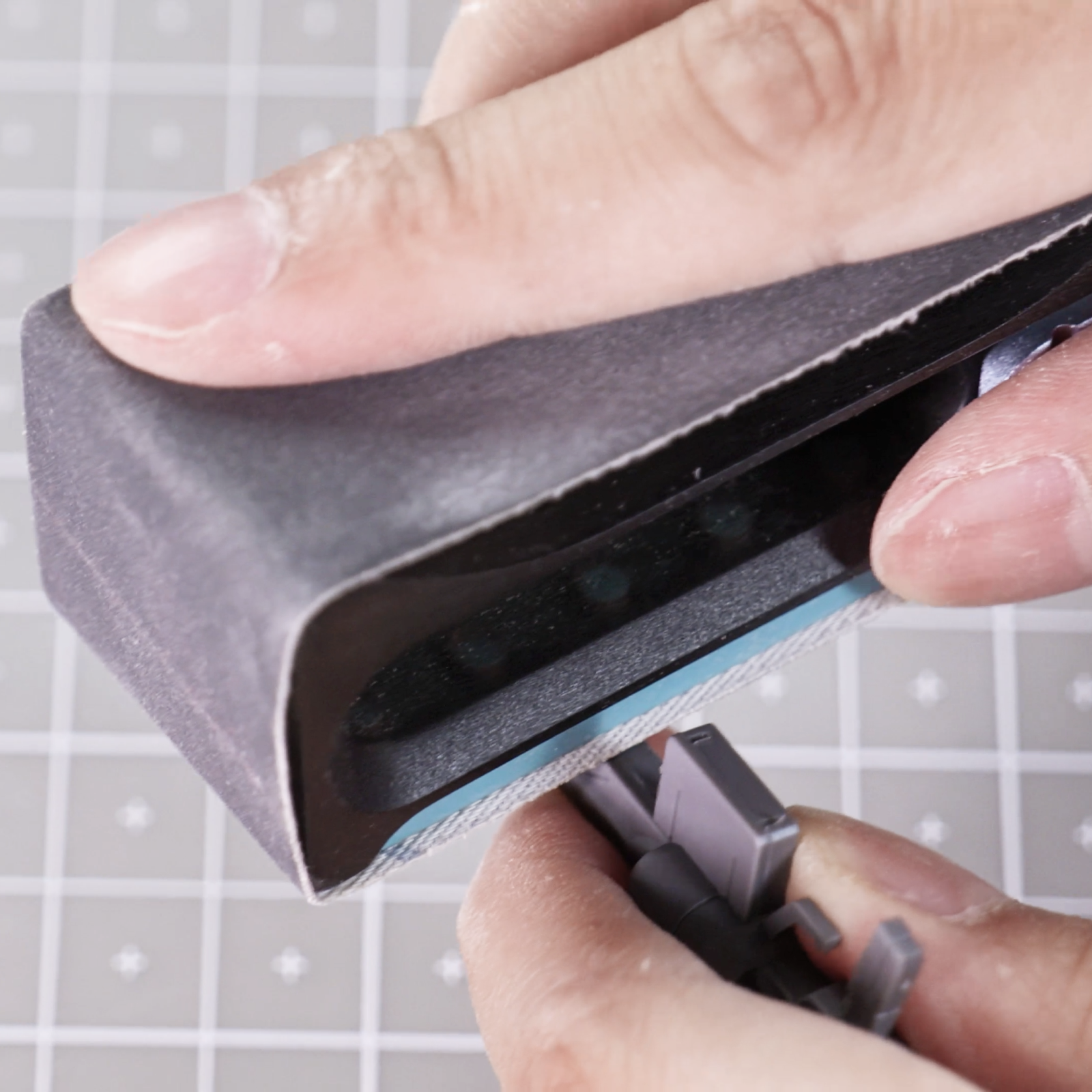 Manual sander polishing acrylic and wood